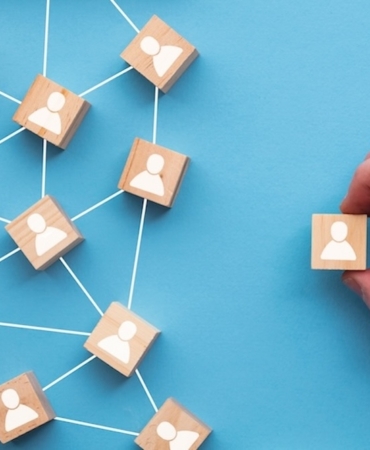 Hand,Choosing,A,Wooden,Block,From,A,Set.,Business,Choice